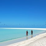 Peaceful Kiribati Beach Scene**

"A tranquil beach scene in Kiribati, with calm turquoise water and white sand, fully clothed tourists enjoying the scenery, a few small fishing boats in the distance, clear blue sky, appropriate attire, safe for work, perfect anatomy, natural proportions, professional photography, high quality, family-friendly atmosphere"

**